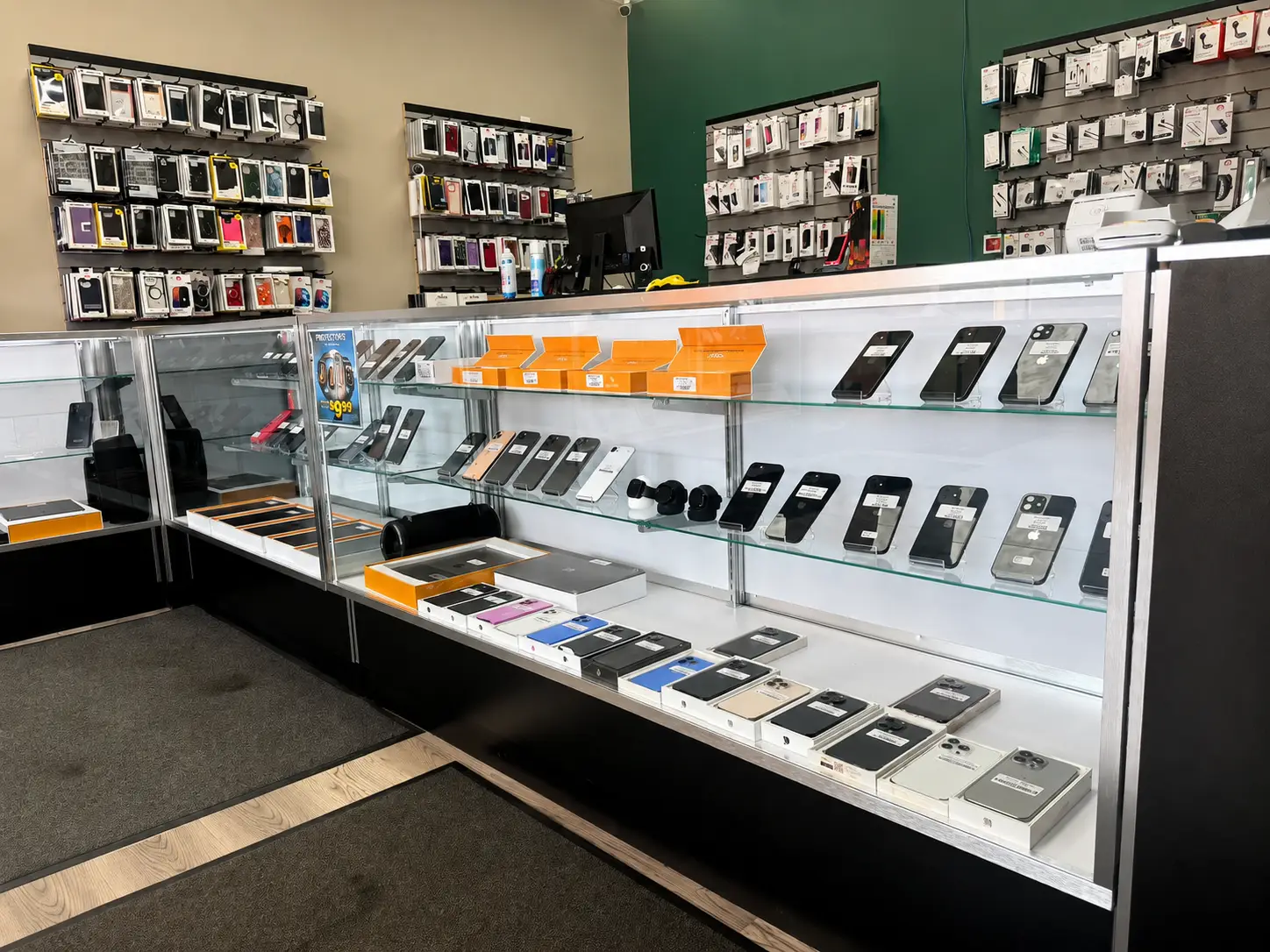 Phone display with iPhones and Android phones at ABC Wireless Florissant